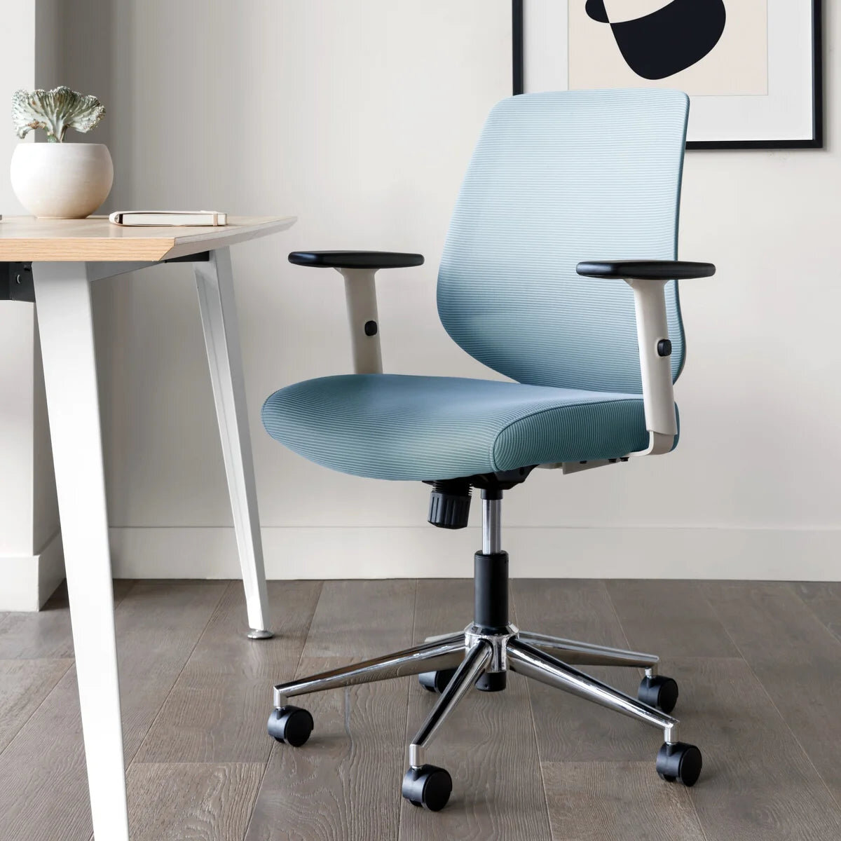 Branch Daily Chair with removable arms in a small room
