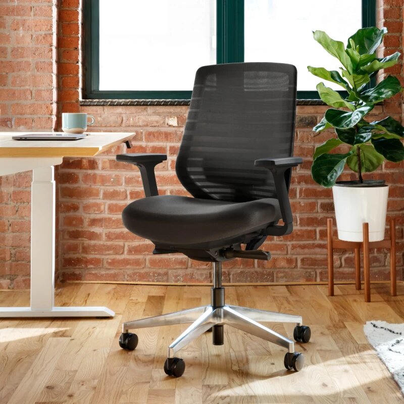 Branch Ergonomic Chair at a compact apartment desk