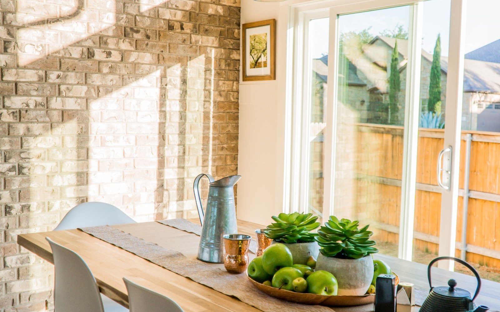 Narrow table parked beside a living-room wall (atmosphere, not a COSCO/Winsome listing photo)