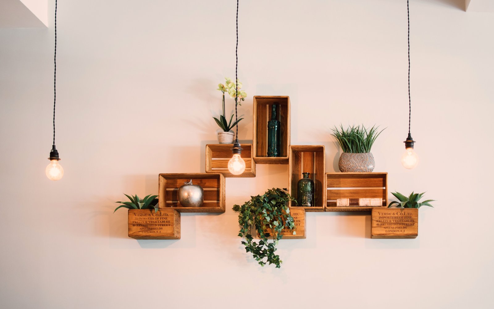 Slim shelving beside a living-room wall — atmosphere, not a product listing photo
